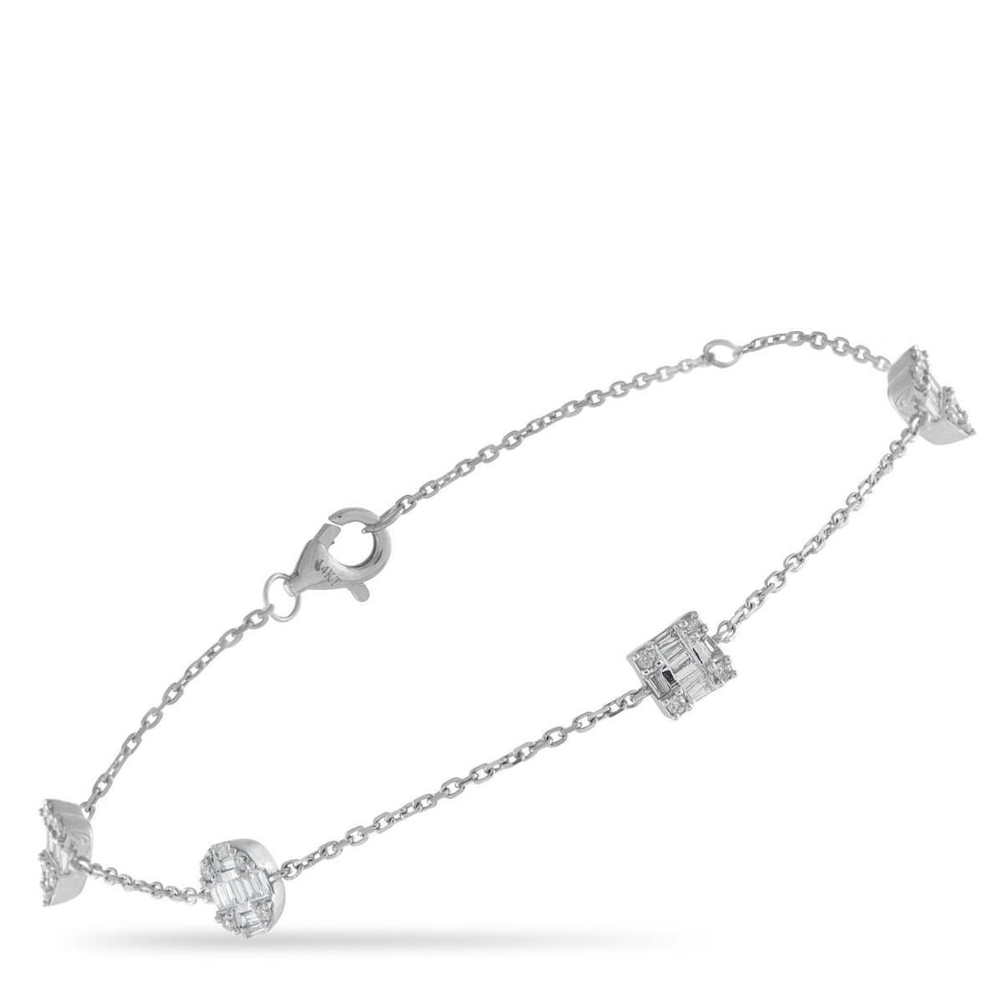 14K WHITE GOLD 0.40CT DIAMOND BRACELET: An exquisite array of Diamonds totaling 0.40 carats makes this delicate bracelet come alive every time it catches the light. Crafted from 14K White Gold, the understated design makes it easy to layer 
