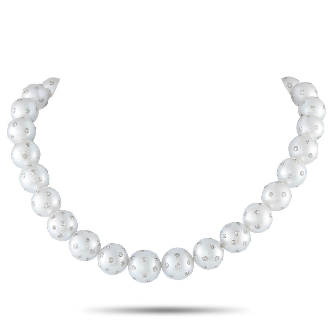 18K WHITE GOLD 3.0CT DIAMOND AND PEARLS NECKLACE: A classic strand, marked by an uncommon surface. A single 15-inch line of 12mm-15mm white pearls creates a full presence at the neck. Each pearl is punctuated with multiple diamonds set flush into the