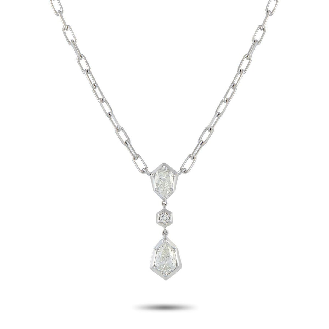 18K WHITE GOLD 1.32 CT DIAMOND NECKLACE: Geometry leads the design, with every stone in this necklace positioned to reinforce its bold look. A pear-shaped diamond, set on four prongs, rests on an angular white gold frame with its pointed end