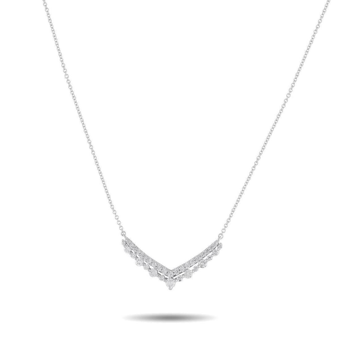 14K WHITE GOLD 0.50CT DIAMOND V PENDANT NECKLACE: In this piece, a fine white gold chain leads to a wide V-shaped pendant that draws the eye with its crisp, layered lines. The upper V is traced by tapering round diamonds held in double shared prongs,