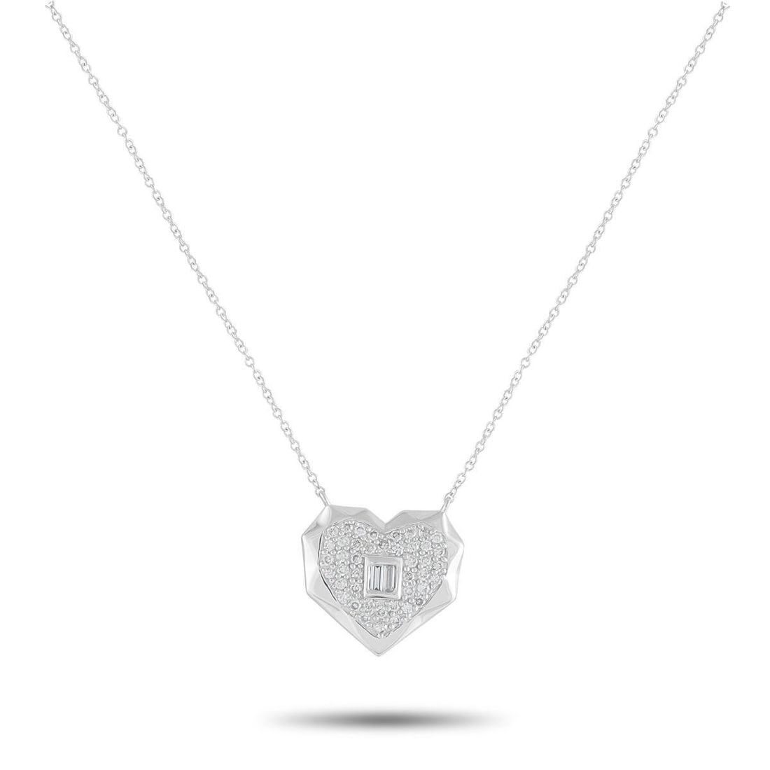 14K WHITE GOLD 0.40CT DIAMOND HEART PENDANT NECKLACE: An artistic heart-shaped pendant makes this 14K White Gold necklace incredibly eye-catching. Sparkling Diamonds with a total weight of 0.40 carats make it a luxurious addition to any ensemble. The dyn