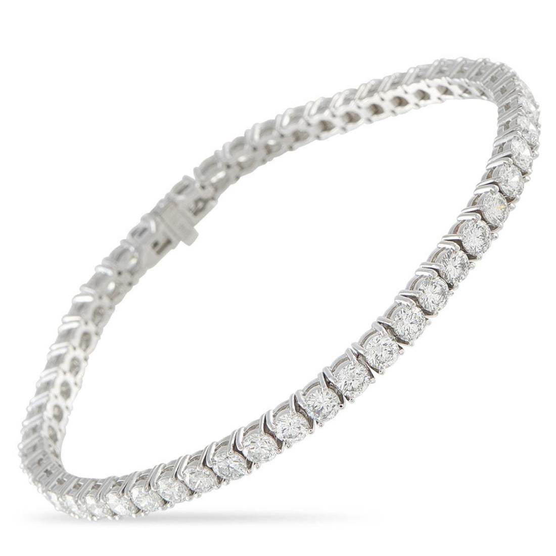 18K WHITE GOLD 8.26CT DIAMOND TENNIS BRACELET: Add a touch of timeless luxury to any ensemble with this tennis bracelet. The simple 18K White Gold setting beautifully showcases sparkling Diamonds with a total weight of 8.26 carats. It measures 7.0