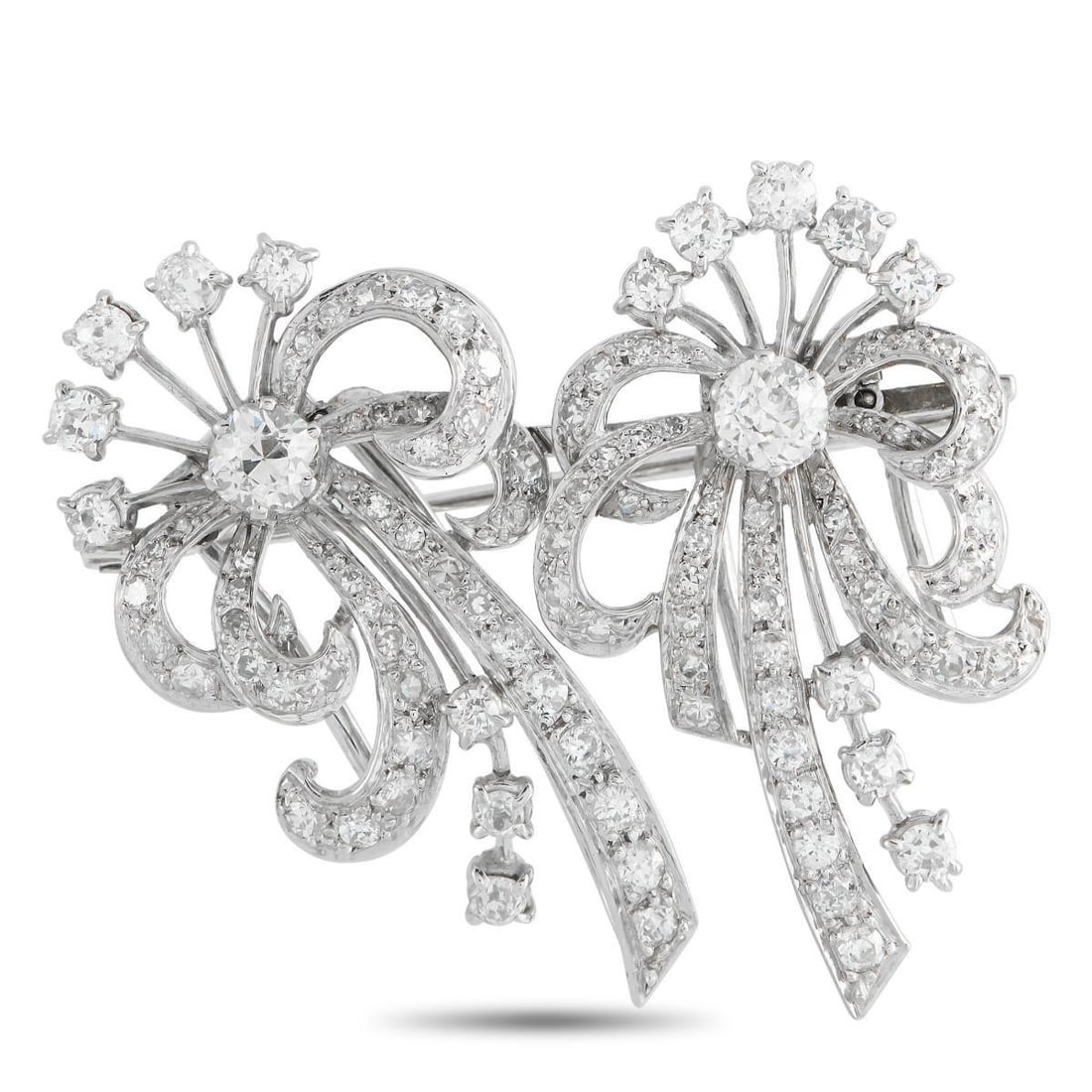 PLATINUM 3.0CT DIAMOND BROOCH: This brooch is a sophisticated luxury piece that is poised to put the perfect finishing touch on any ensemble. The intricate Platinum setting is elevated by sparkling Diamonds with a total weight of 3