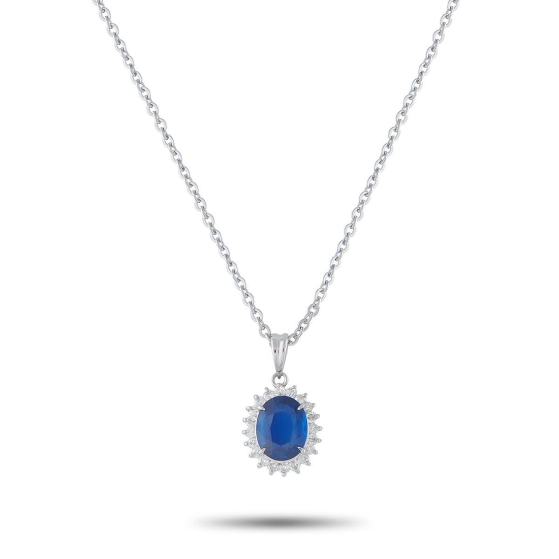 PLATINUM 0.25CT DIAMOND AND SAPPHIRE PENDANT NECKLACE: This luxury necklace will never go out of style. A vibrant 1.62 carat Sapphire makes a statement at the center, while sparkling Diamonds totaling 0.25 carats provide the perfect finishing touch. Set i