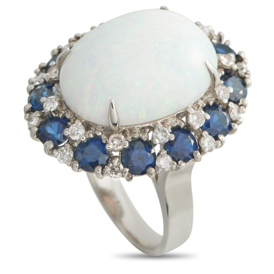 14K WHITE GOLD 0.45CT DIAMOND, SAPPHIRE, AND OPAL RING: A striking combination of colors and materials makes this ring simply unforgettable. At the center, a glistening 5.0 carat Opal instantly captures the imagination. Its surrounded by a halo of sparklin