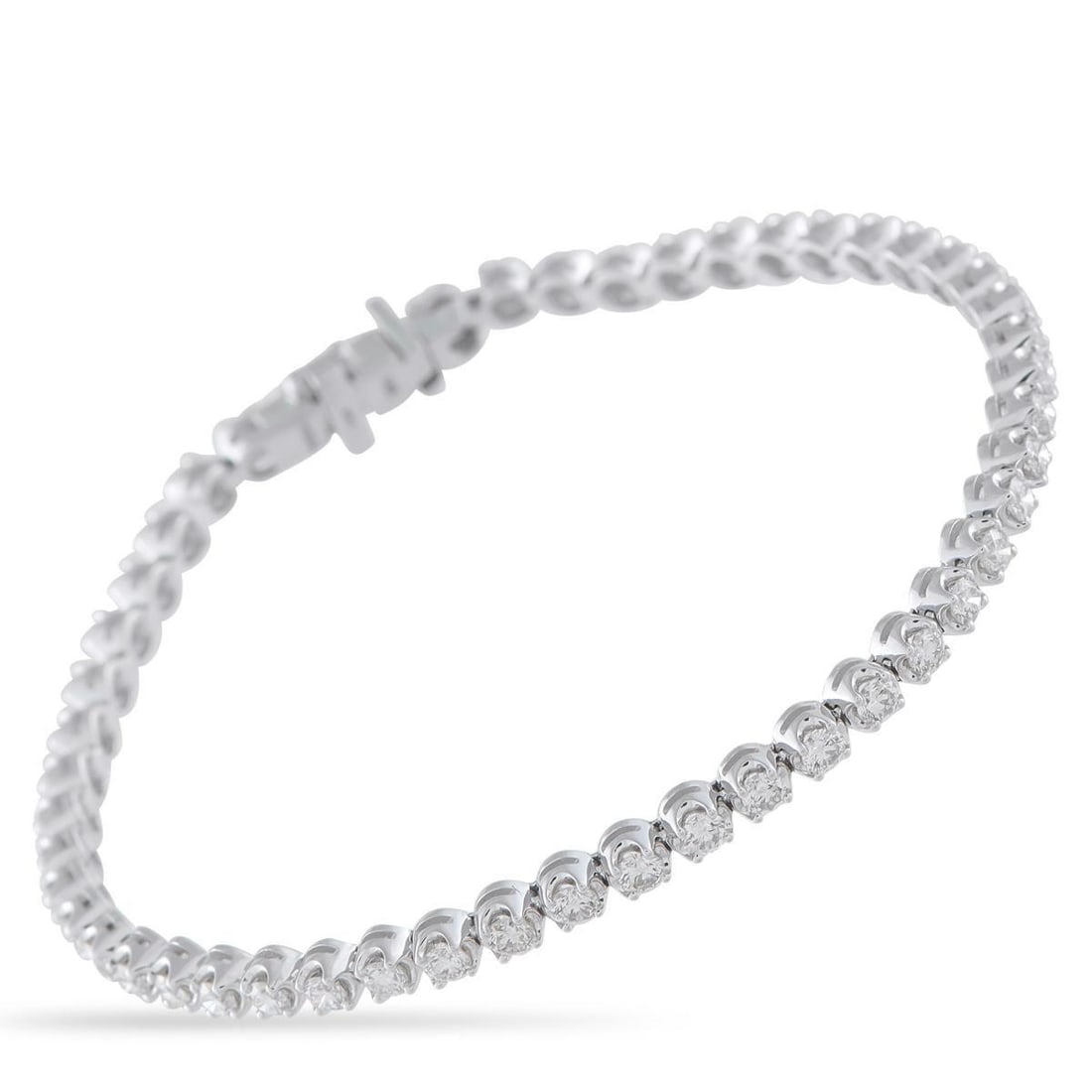 14K WHITE GOLD 2.55CT DIAMOND TENNIS BRACELET: Day or night, this tennis bracelet adapts to any look. It's fashioned in 14K white gold and carries a total of 2.55 carats of diamonds, each set to catch light from every angle. The generous carat wei