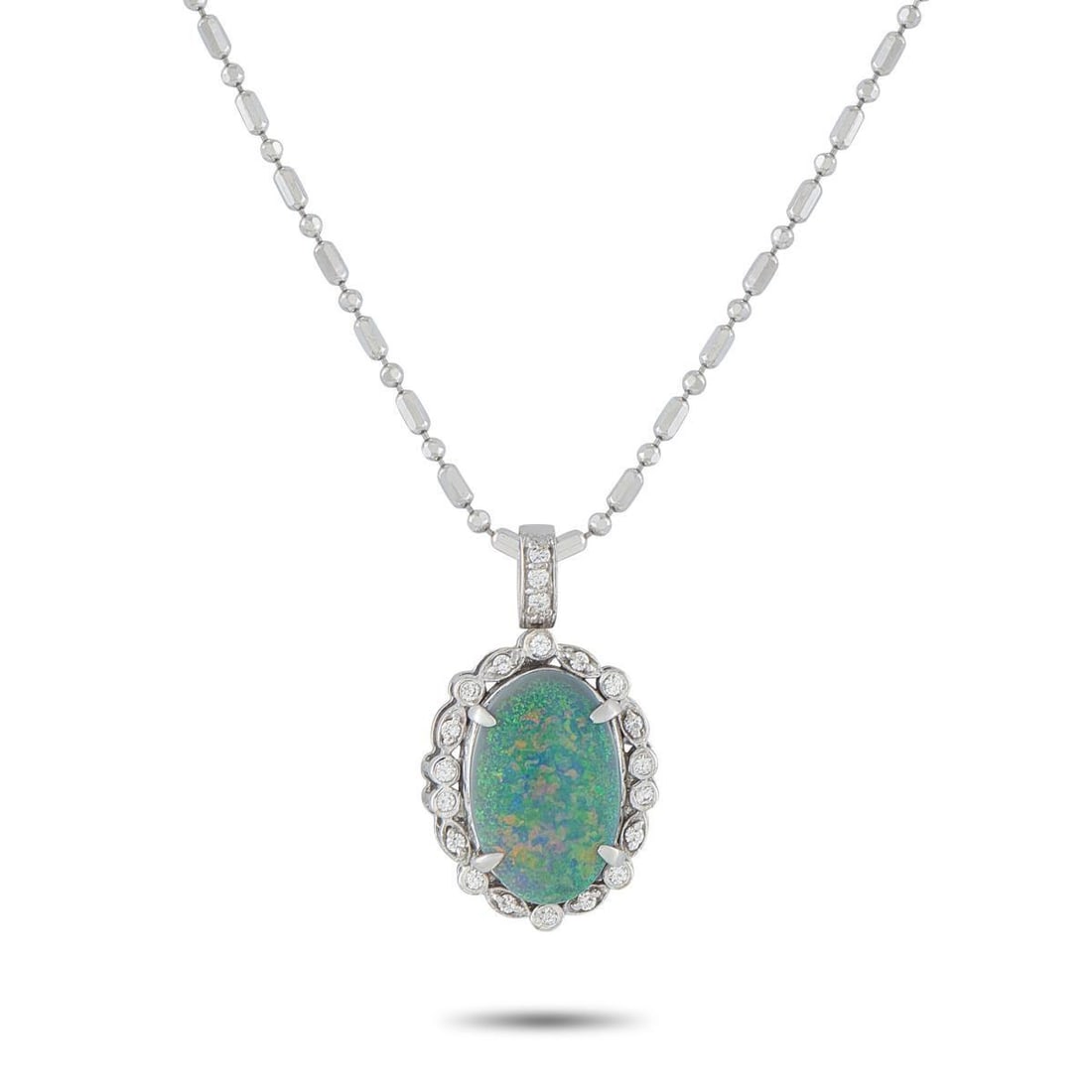 18K WHITE GOLD 0.20CT DIAMOND AND OPAL PENDANT NECKLACE: A 3.05 carat green Opal center stone adds color, texture, and dimension to this captivating necklace. Set in 18K White Gold, Diamonds totaling 0.20 carats surround the center stone for an added touch 