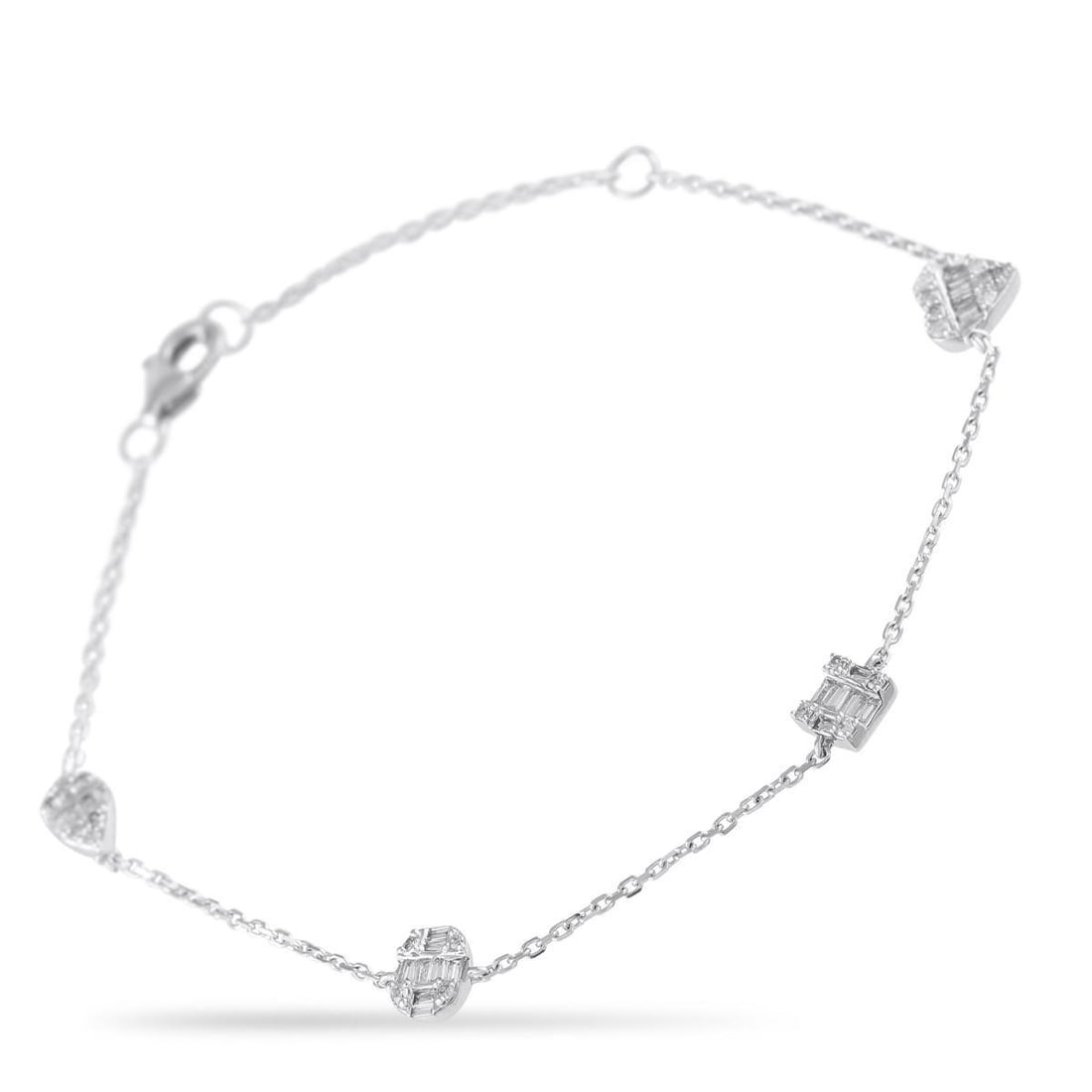 14K WHITE GOLD 0.40CT DIAMOND STATION BRACELET: This stunning 14K White Gold bracelet is stylish enough for wear alone but understated enough to be layered with other luxury pieces. Incredibly elegant, the 7 chain is elevated by sparkling Diamond a