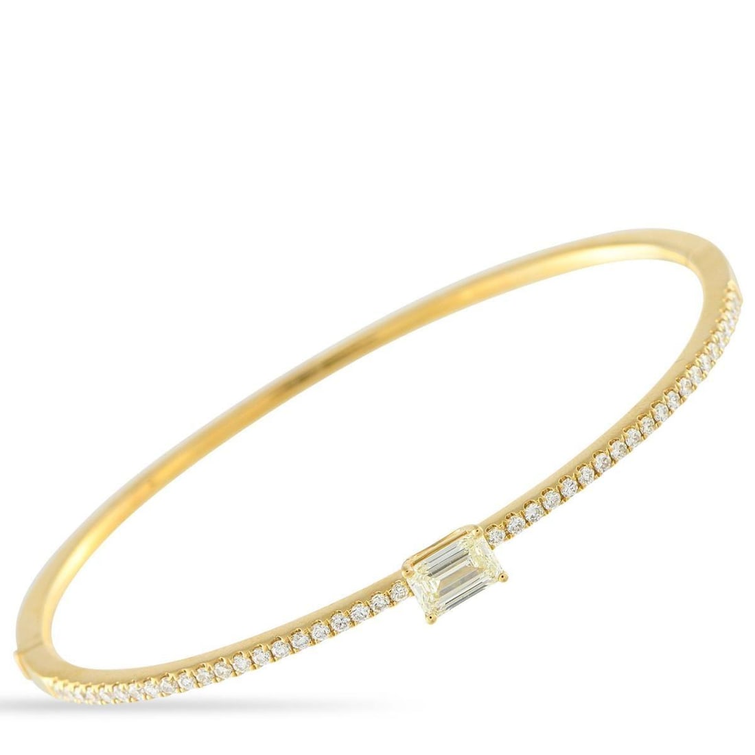 18K YELLOW GOLD 1.30CT DIAMOND BRACELET: This Odelia bangle bracelet is simple, elegant, and endlessly charming. A 0.75 carat Diamond makes a statement at the center of the sophisticated design. Additional Diamond accents totaling 0.55 carat