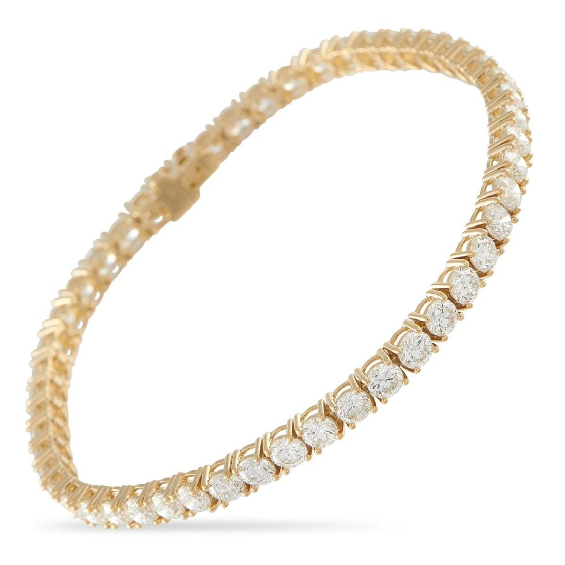 18K YELLOW GOLD 8.44CT DIAMOND TENNIS BRACELET: This classic tennis bracelet will never go out of style. On this elegant piece, sparkling Diamonds totaling 8.44 carats contrast against the opulent 18K Yellow Gold setting. It measures 7.5 long and i
