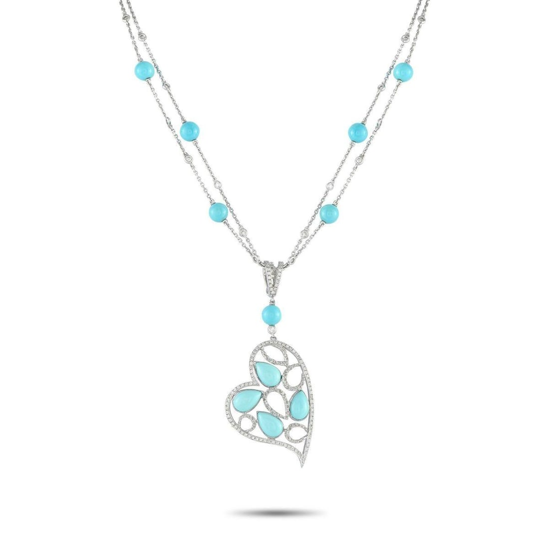 18K WHITE GOLD 1.05CT DIAMOND AND TURQUOISE HEART NECKLACE: Theres something incredibly captivating about this exquisite luxury necklace. Turquoise stones add color to the entire design, while sparkling Diamonds totaling 1.05 carats provide plenty of sparkle. 