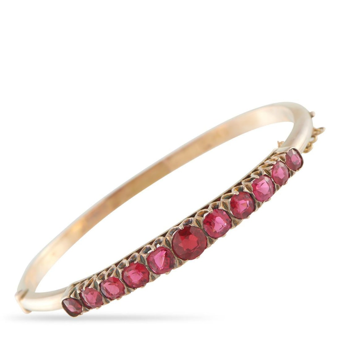 ANTIQUE 14K ROSE GOLD GARNET BRACELET: This antique bangle bracelet exudes vintage sophistication. Simple and elegant, the sleek 14K Rose Gold setting is elevated by a series of sparkling Garnet gemstones. It measures 7.0 long and includes