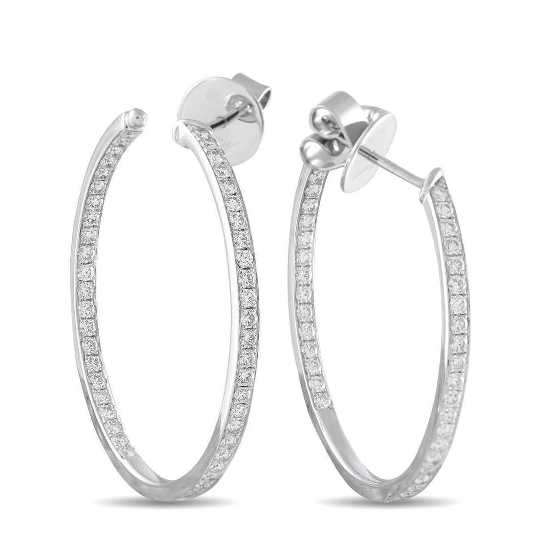 MEMOIRE 18K WHITE GOLD 1.50CT DIAMOND INSIDE-OUT HOOP EARRINGS: These Memoire hoop earrings are simple and incredibly elegant. Diamonds with a total weight of 1.50 carats add a touch of luxury to the understated design. Set in 18K White Gold, each one measures 1.3