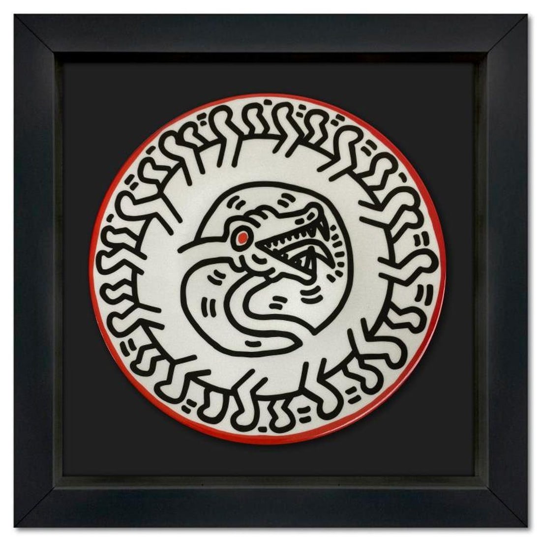 Keith Haring (1958-1990), "Serpent" Framed Limoges Porcelain Plate.: Serpent is a Limoges porcelain plate bearing the plate signature inverso of Keith Haring (1958-1990). This plate is custom framed and floated on linen. Measures approx. 13.5" x 13.5" (frame), 8.5" (pl