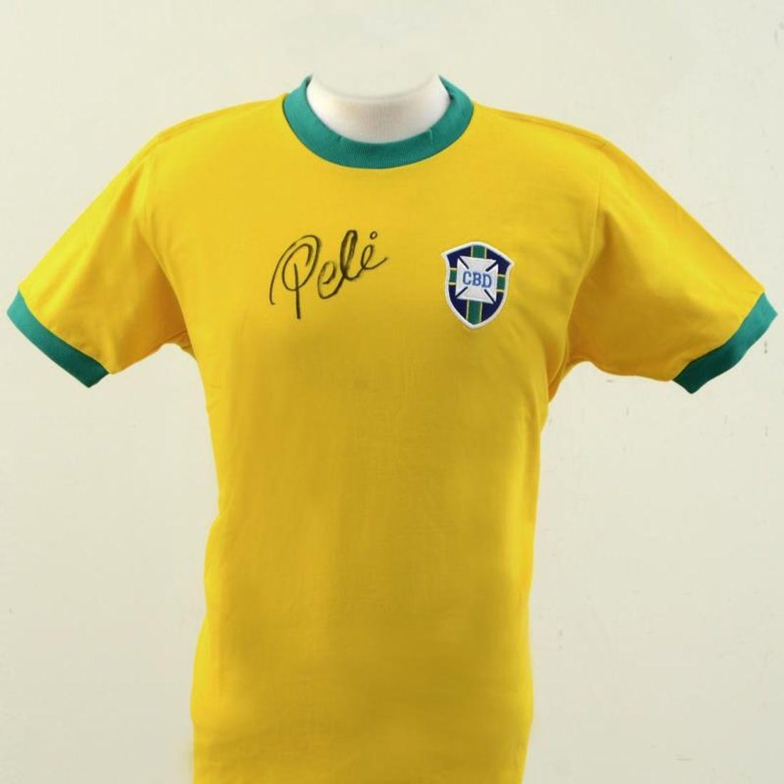 Brazil Soccer Jersey Autographed by Pele: This is a replica Brazil soccer Jersey autographed by legendary Brazilian footballer, Pele! This piece is presented with a Letter of Authenticity from PSA/DNA, which authenticates sports memorabilia u