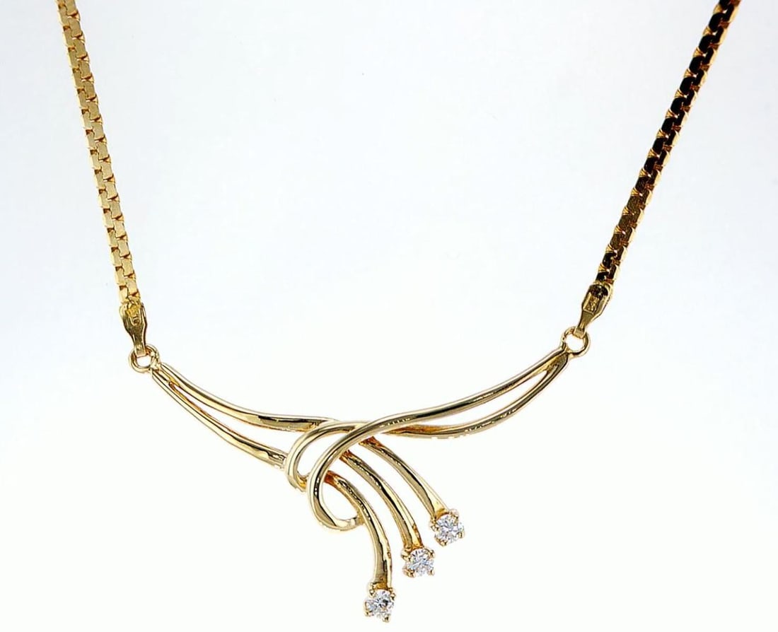 14kt Yellow Gold 0.26ctw Diamond Pendant: One 14k yellow gold pendant with chain (14k stamped), set with natural diamonds. Jewelry Weight: 7.81Grs Total Diamonds Weight: 0.26Cts Main Stones Description: Quantity: 3 Cut and shape: Round Brilli
