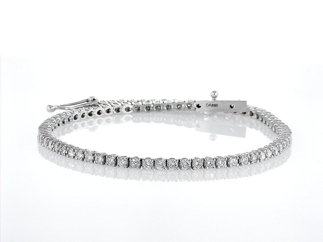 14kt White Gold 2.4ctw Diamond Tennis Bracelet: One 14k white gold bracelet "Tennis" (585 stamped), set with natural diamonds. Jewelry Weight: 6.03Grs Total Diamonds Weight: 2.4Cts Main Stones Description: Quantity: 80 Cut and shape: Round Brillian