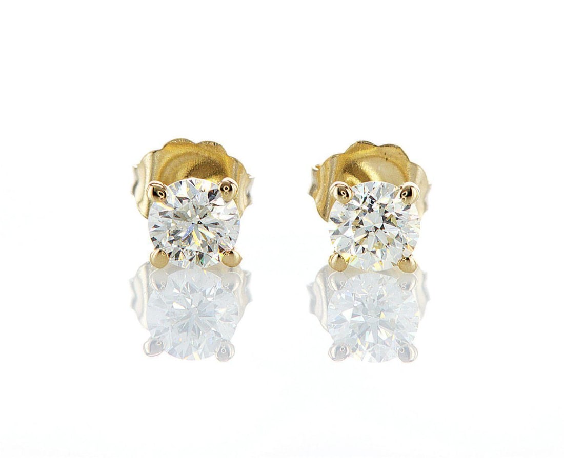 14kt Yellow Gold 0.78ctw Diamond Earrings: One pair of 14k yellow gold earrings, each set with one natural diamond. Jewelry Weight: 0.81Grs Total Diamonds Weight: 0.78Cts Main Stones Description: Quantity: 2 Cut and shape: Round Brilliant Cara
