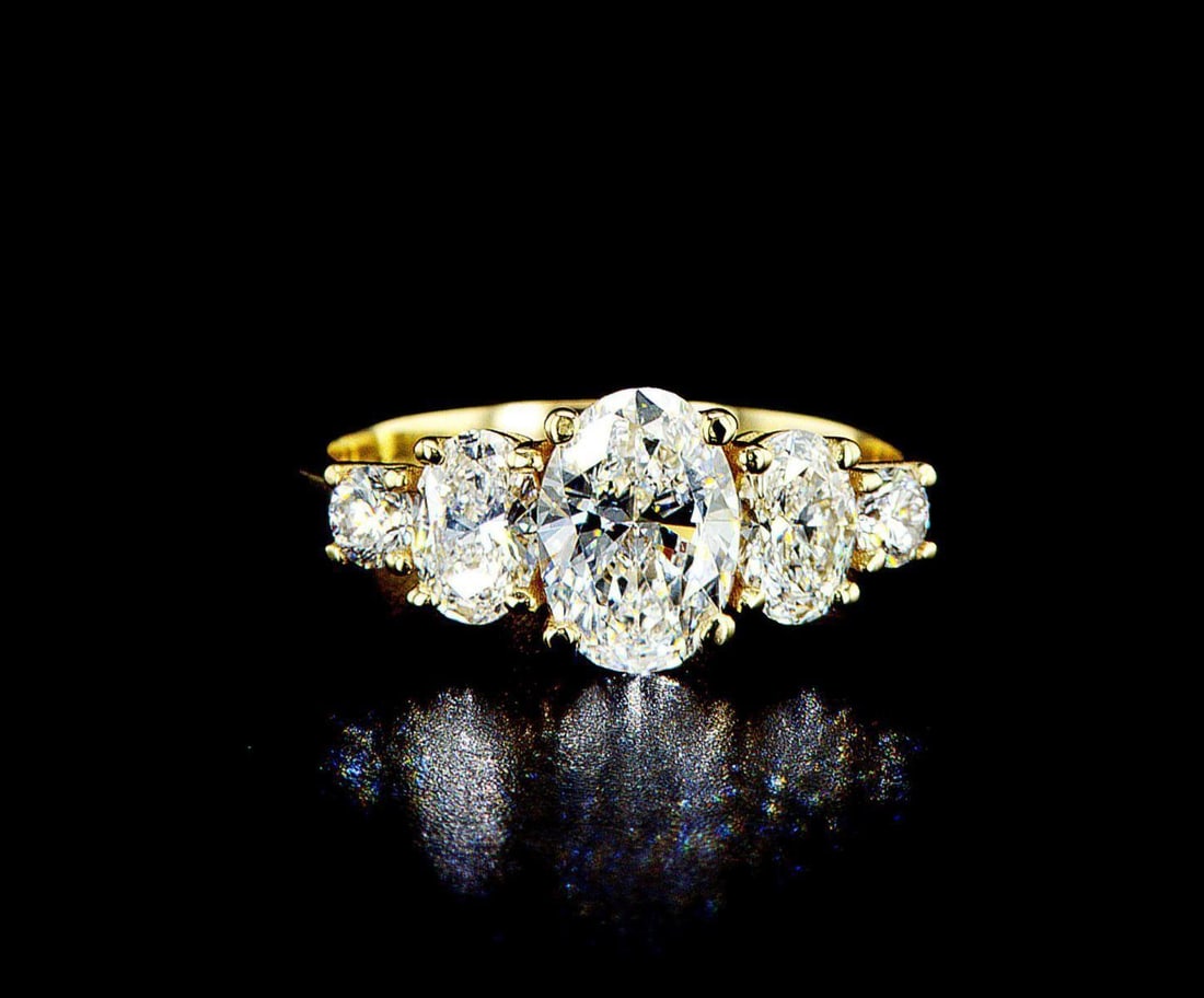 14k yellow gold 2.04ctw Diamond Ring: One 14k yellow gold ring, set with one center lab grown diamond and small lab grown diamonds on the sides. Jewelry Weight: 3.38Grs Total Diamonds Weight: 2.04Cts Main Stones Description: Quantity: 1 C
