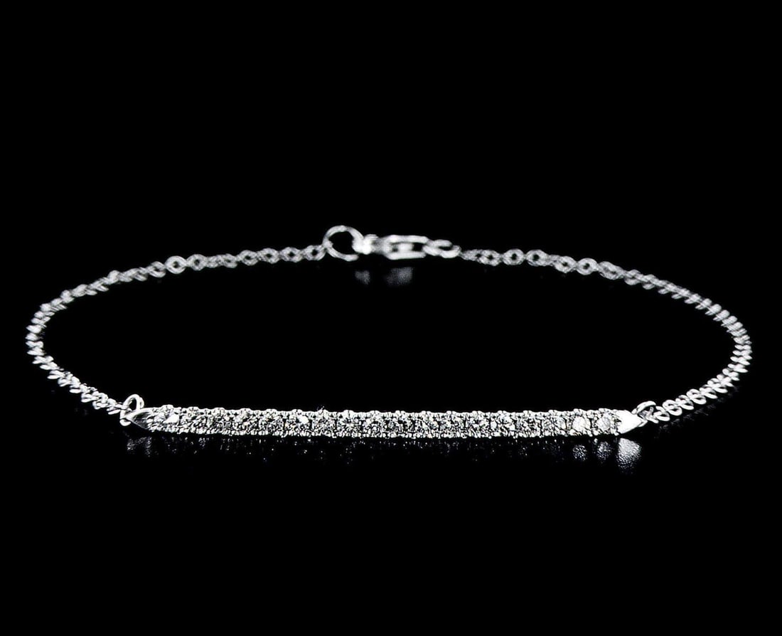 White Gold 0.4ctw Diamond Bracelet: One white gold bracelet, set with natural diamonds. Jewelry Weight: 1.87Grs Total Diamonds Weight: 0.4Cts Main Stones Description: Cut and shape: Round Brilliant Carats Weight: 0.4 Clarity: VS Color: 