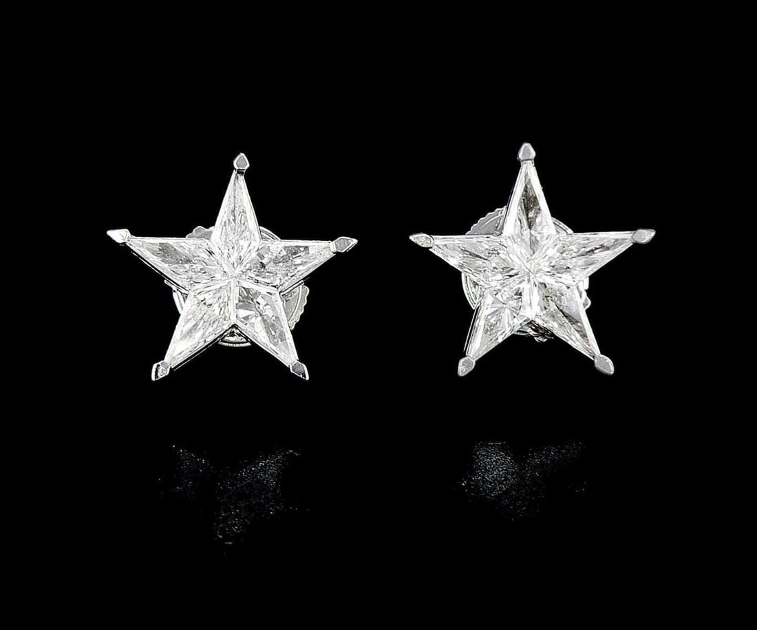 18kt White Gold 1.07ctw Diamond Earrings: One pair of 18k white gold earrings (18k stamped), each set with five natural diamonds Jewelry Weight: 2.42Grs Total Diamonds Weight: 1.07Cts Main Stones Description: Quantity: 10 Cut and shape: Noble