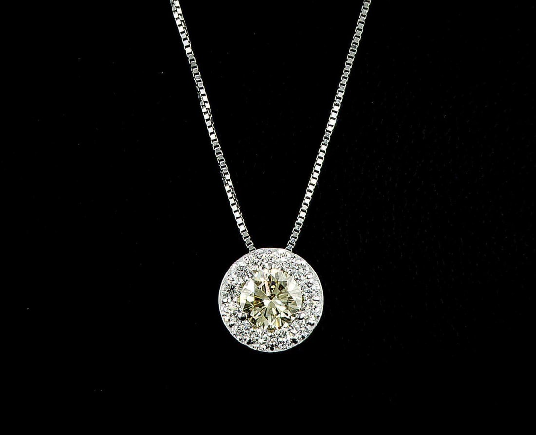 14kt White Gold 0.63ctw Diamond Pendant: One 14k white gold pendant, set with one center natural diamond and small natural diamonds around. Jewelry Weight: 0.53Grs Total Diamonds Weight: 0.63Cts Main Stones Description: Quantity: 1 Cut and s