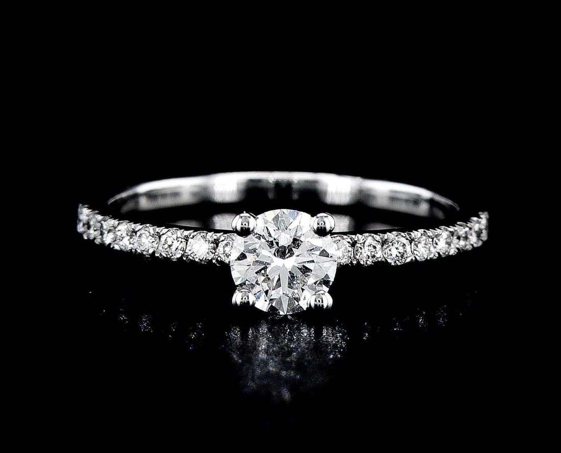 14kt White Gold 0.8ctw Diamond Ring: One 14k white gold ring (14k stamped), set with one center lab grown diamond and small lab grown diamonds around and on the sides. Jewelry Weight: 2.09Grs Total Diamonds Weight: 0.8Cts Main Stones Des