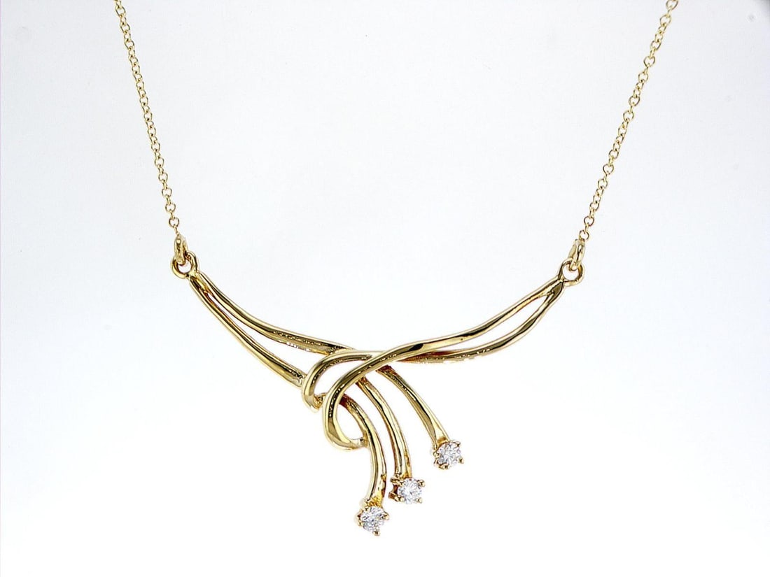 14kt Yellow Gold 0.26ctw Diamond Pendant: One 14k yellow gold pendant with chain (14k stamped), set with natural diamonds. Jewelry Weight: 4.69Grs Total Diamonds Weight: 0.26Cts Main Stones Description: Quantity: 3 Cut and shape: Round Brilli