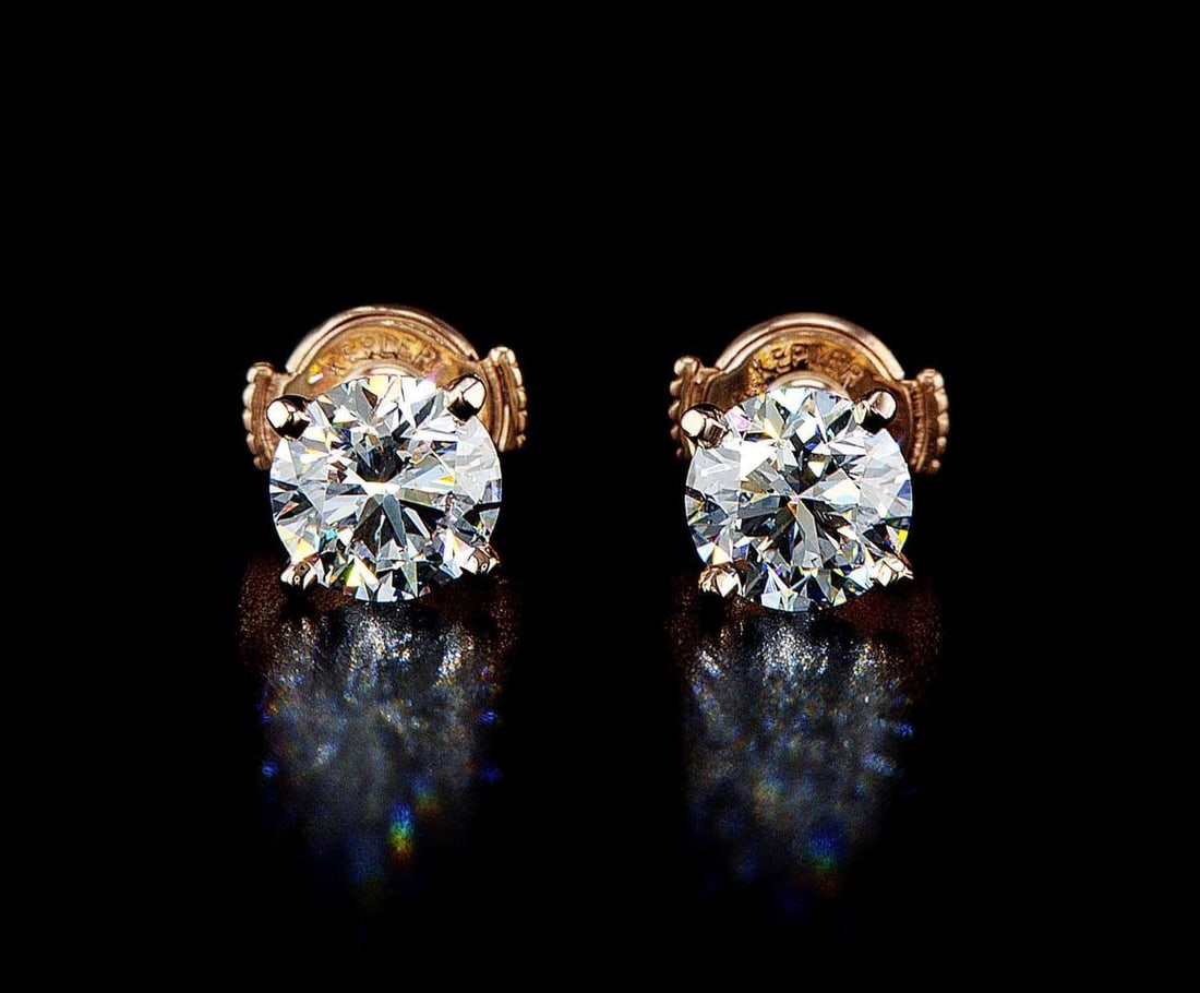 14kt Rose Gold 2.05ctw Diamond Earrings: One pair of 14k rose gold earrings, each set with one lab grown diamond. Jewelry Weight: 1.65Grs Total Diamonds Weight: 2.05Cts Main Stones Description: Quantity: 2 Cut and shape: Round Brilliant Cara
