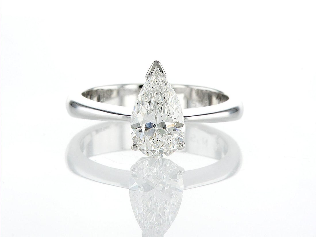 14kt White Gold 2ctw Diamond Ring: One 14k white gold ring (585 stamped), set with one center natural diamond. Jewelry Weight: 5.34Grs Total Diamonds Weight: 2Cts Main Stones Description: Quantity: 1 Cut and shape: Pear Carats Weight: 