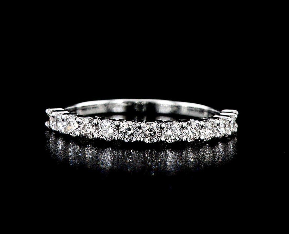 14kt White Gold 0.64ctw Diamond Ring: One 1.88 gr. 14kt White Gold Diamond Ring Jewelry Weight: 1.88Grs Total Diamonds Weight: 0.64Cts Main Stones Description: Quantity: 13 Cut and shape: Round Brilliant Carats Weight: 0.64 Clarity: VS2-S