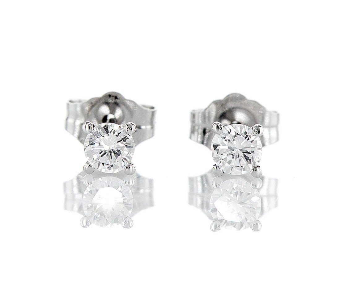 14kt White Gold 0.3ctw Diamond Earrings: One pair of 14k white gold earrings (14k stamped), each set with one lab grown diamond Jewelry Weight: 0.6Grs Total Diamonds Weight: 0.3Cts Main Stones Description: Quantity: 2 Cut and shape: Round Br
