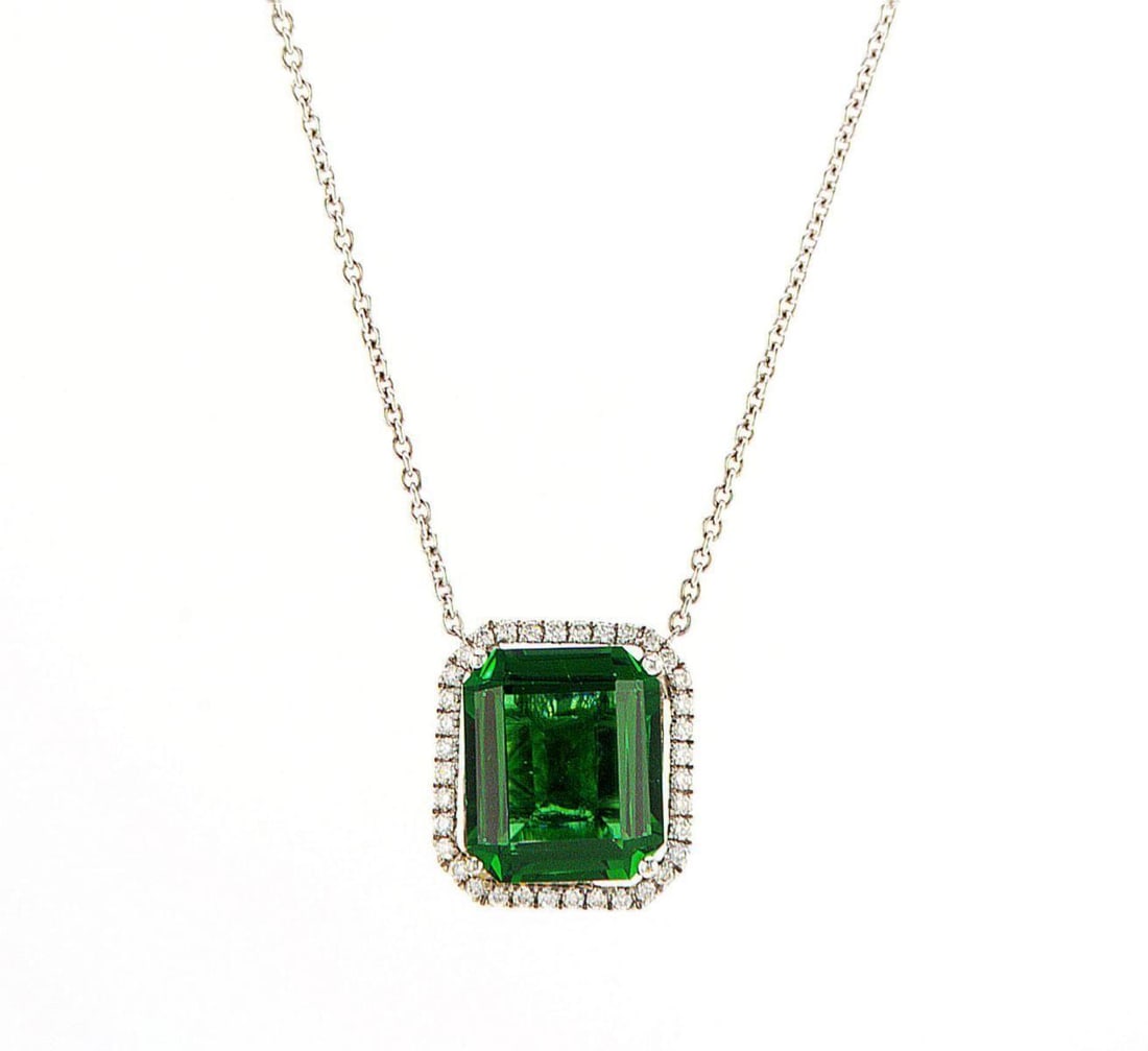14kt White Gold 0.18ctw Diamond Pendant: Jewelry Description Description: One 14k white gold pendant, set with natural diamonds and lab grown emerald. Jewelry Weight: 3.68 Grs Total Diamonds Weight: 0.18 Cts Precious Metal: 14kt White Gold C