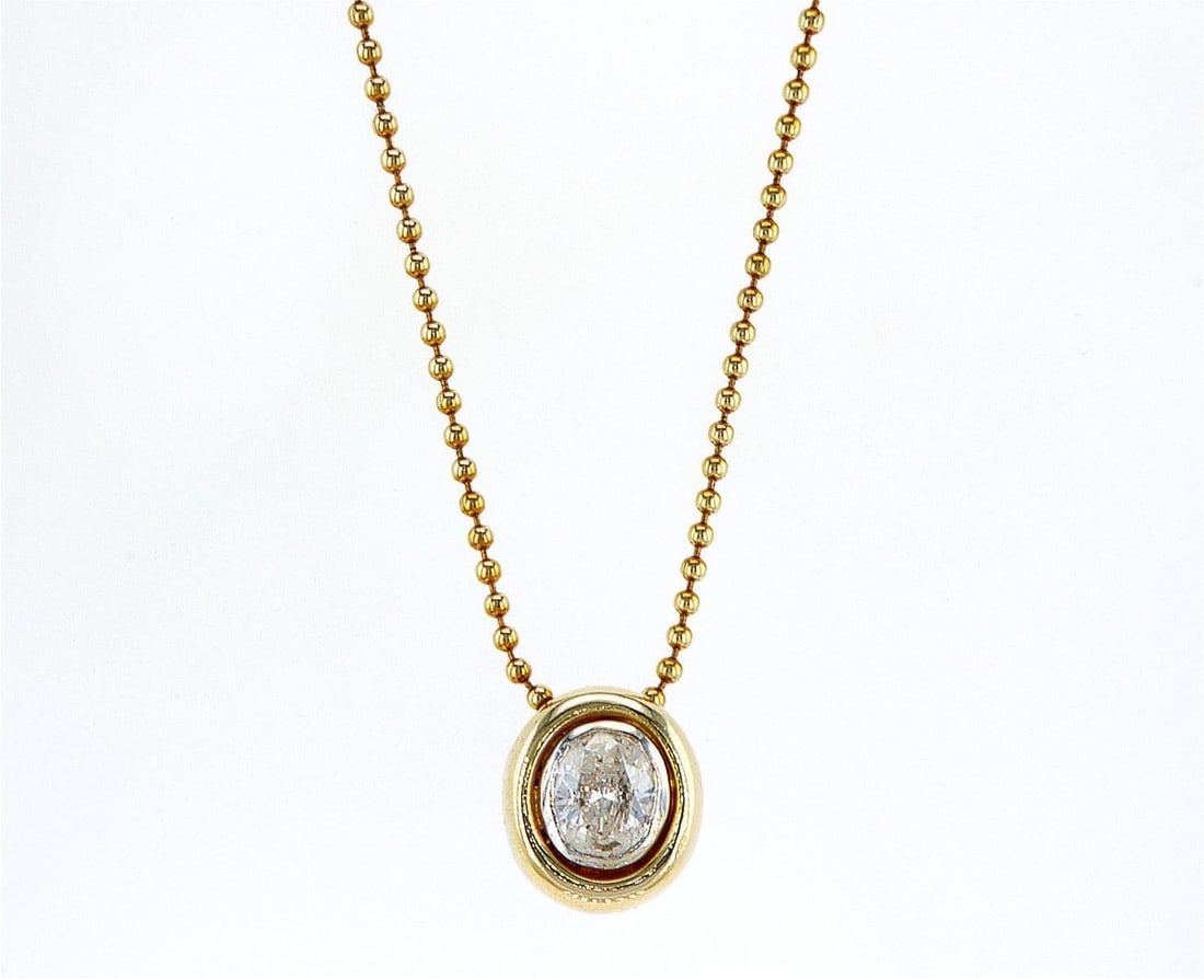 14kt Yellow Gold 0.63ctw Diamond Pendant: One 14k yellow gold pendant with chain (585 stamped), set with one center natural diamond. Jewelry Weight: Grs Total Diamonds Weight: 0.63Cts Main Stones Description: Quantity: 1 Cut and shape: Oval C