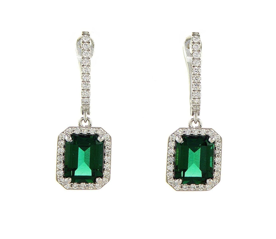 14kt White Gold 0.74ctw Diamond Earrings: One pair of 14k white gold earrings, set with lab grown diamonds. Jewelry Weight: 5.81Grs Total Diamonds Weight: 0.74Cts Main Stones Description: Quantity: 2 Cut and shape: Emerald Carats Weight: 4.53