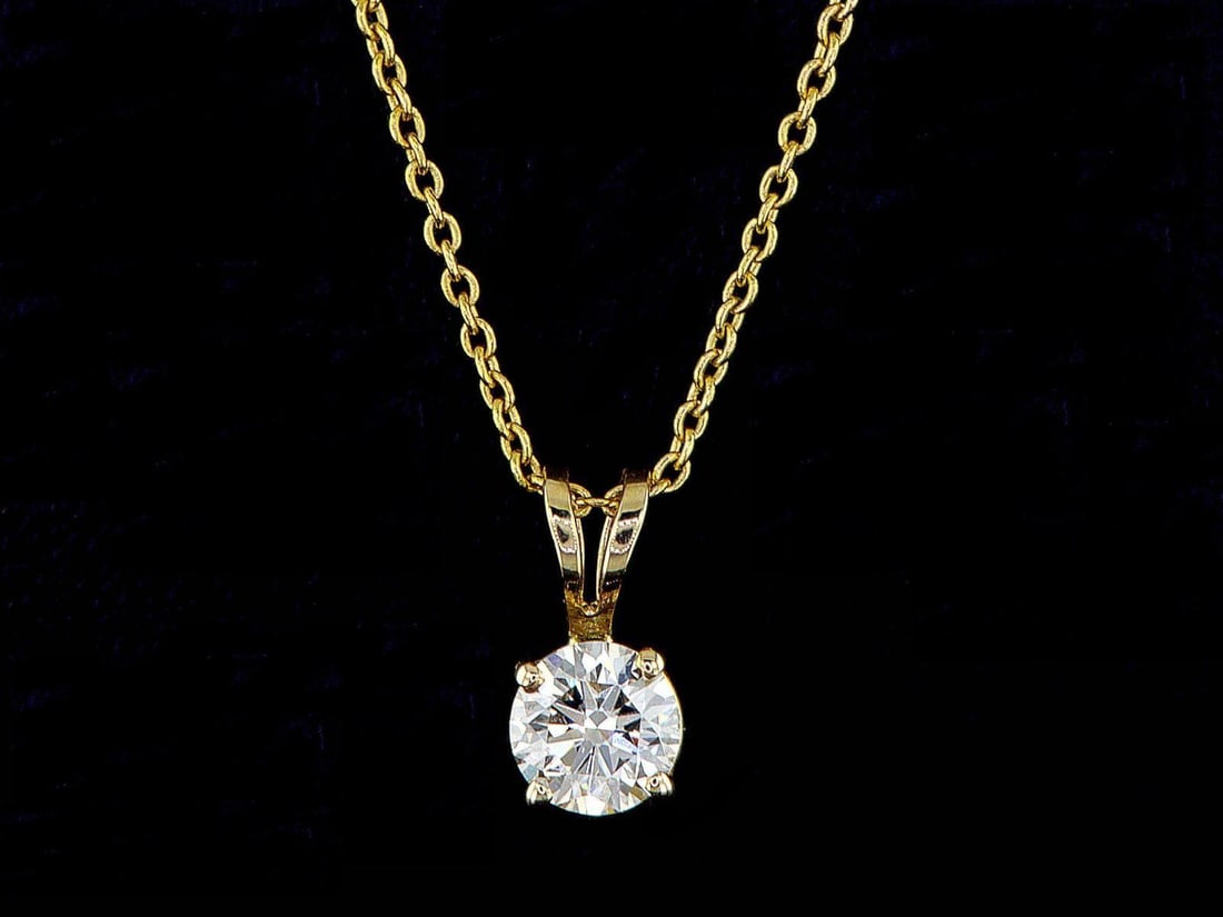 14kt Yellow Gold 0.4ctw Diamond Pendant: One 14k yellow gold pendant with chain (14k stamped), set with one center natural diamond. Natural diamonds description: Cut and shape: Round Brilliant. Total Weight: 0.40 cts. Cut/Polish/Symmetry: Ex