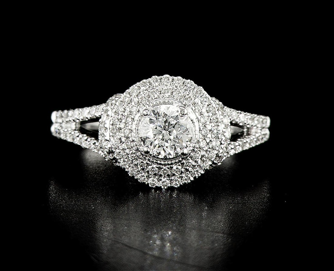 14kt White Gold 0.95ctw Diamond Ring: One 14k white gold ring (14k stamped), set with one center natural diamond and small natural diamonds around and on the sides. Jewelry Weight: 4.65Grs Total Diamonds Weight: 0.95Cts Main Stones Descri