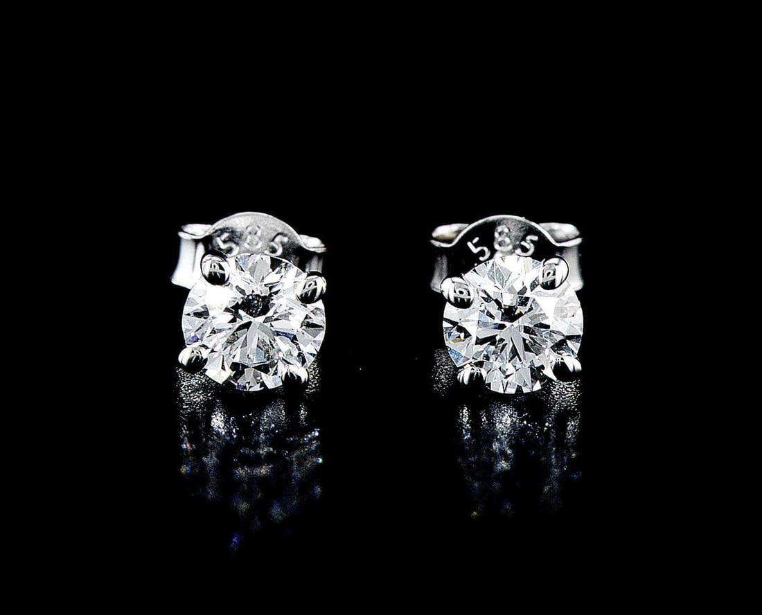 14kt White Gold 1.15ctw Diamond Earrings: One pair of 14k white gold earrings (14k stamped), each set with lab grown. Jewelry Weight: 1.09Grs Total Diamonds Weight: 1.15Cts Main Stones Description: Quantity: 2 Cut and shape: Round Brilliant C