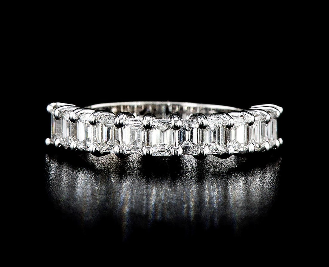 14kt White Gold 1.77ctw Diamond Ring: One 3.49 gr. 14kt White Gold Diamond Ring Jewelry Weight: 3.49Grs Total Diamonds Weight: 1.77Cts Main Stones Description: Quantity: 12 Cut and shape: Emerald Cut Carats Weight: 1.77 Clarity: VS1-VS2 C
