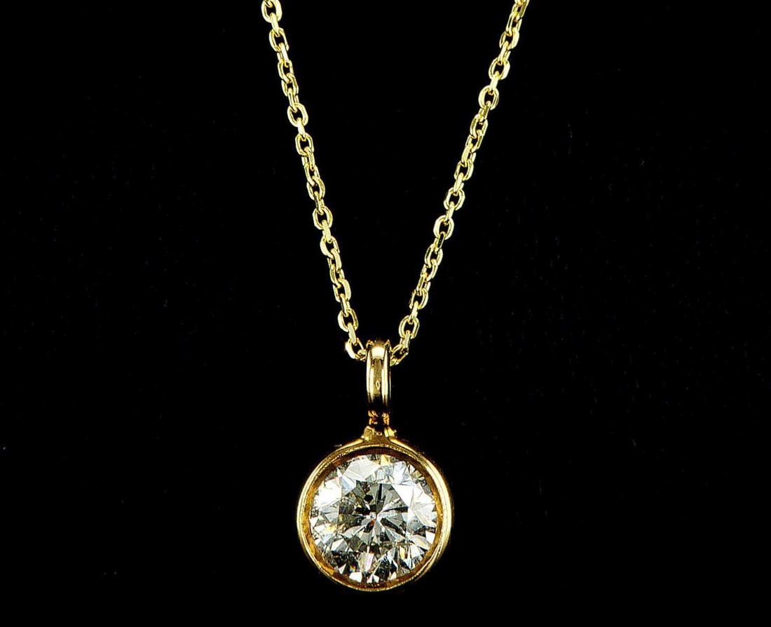 14kt Yellow Gold 1.3ctw Diamond Pendant: One 14k yellow gold pendant with chain, set with one center natural diamond. Jewelry Weight: 2.2Grs Total Diamonds Weight: 1.3Cts Main Stones Description: Quantity: 1 Cut and shape: Round Brilliant Ca