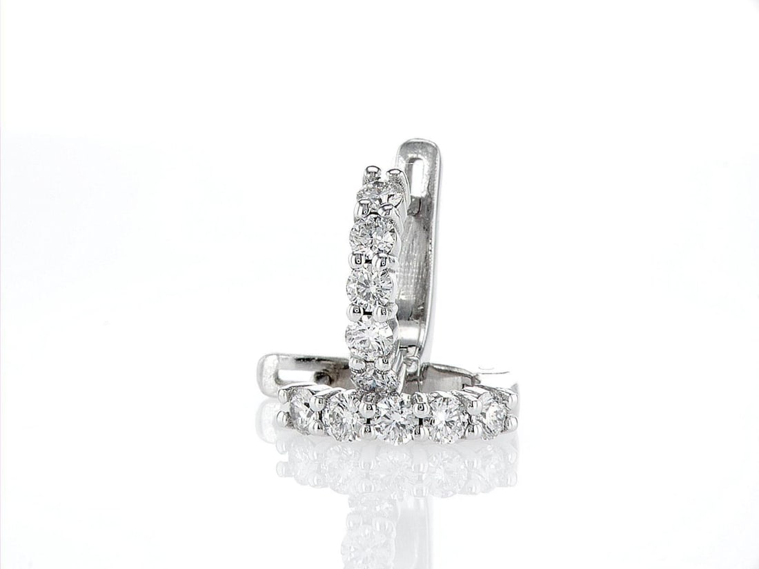 14kt White Gold 0.68ctw Diamond Earrings: One pair of 14k white gold earrings (14k stamped), each set with natural diamonds. Jewelry Weight: 3.29Grs Total Diamonds Weight: 0.68Cts Main Stones Description: Cut and shape: Round Brilliant Carats