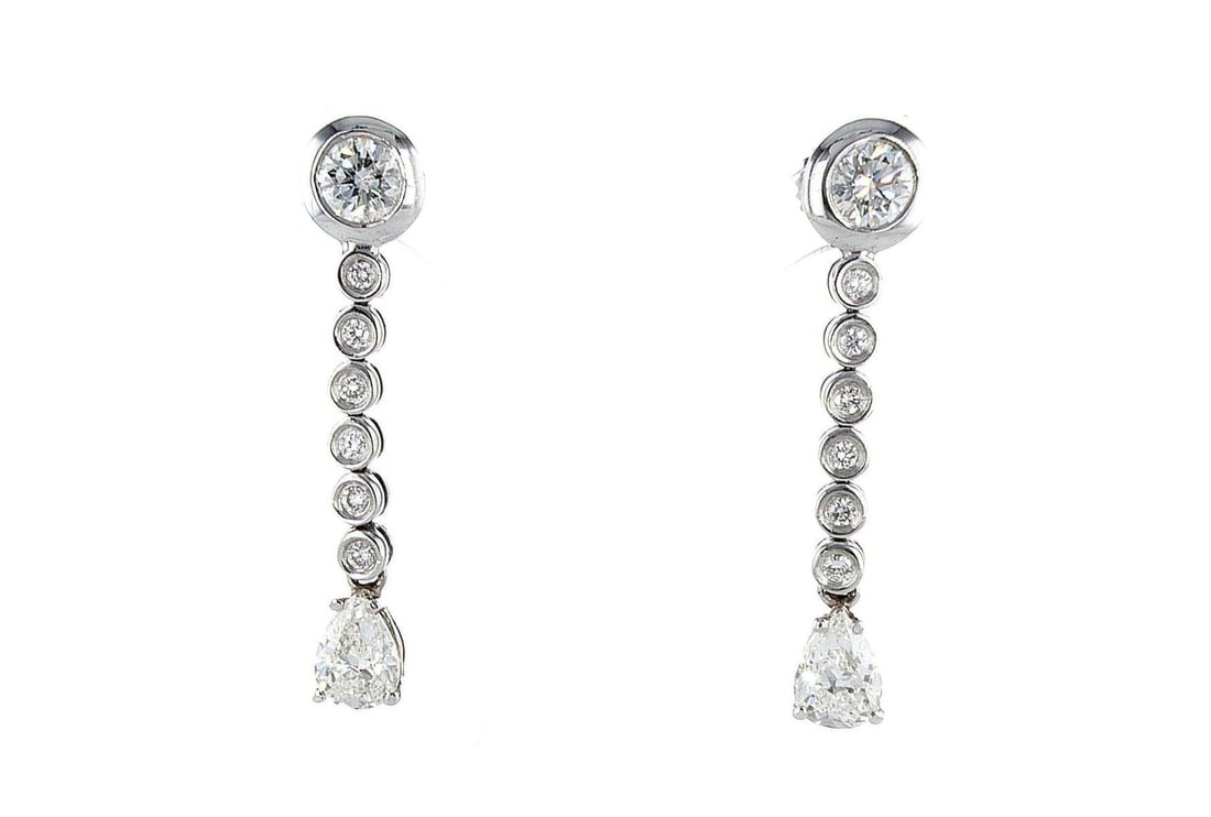 14kt White Gold 3.2ctw Diamond Earrings: One pair of 14k white gold earrings (14k stamped), each set with natural diamonds. Jewelry Weight: 5.91Grs Total Diamonds Weight: 3.2Cts Main Stones Description: Quantity: 16 Cut and shape: Pear & Rou