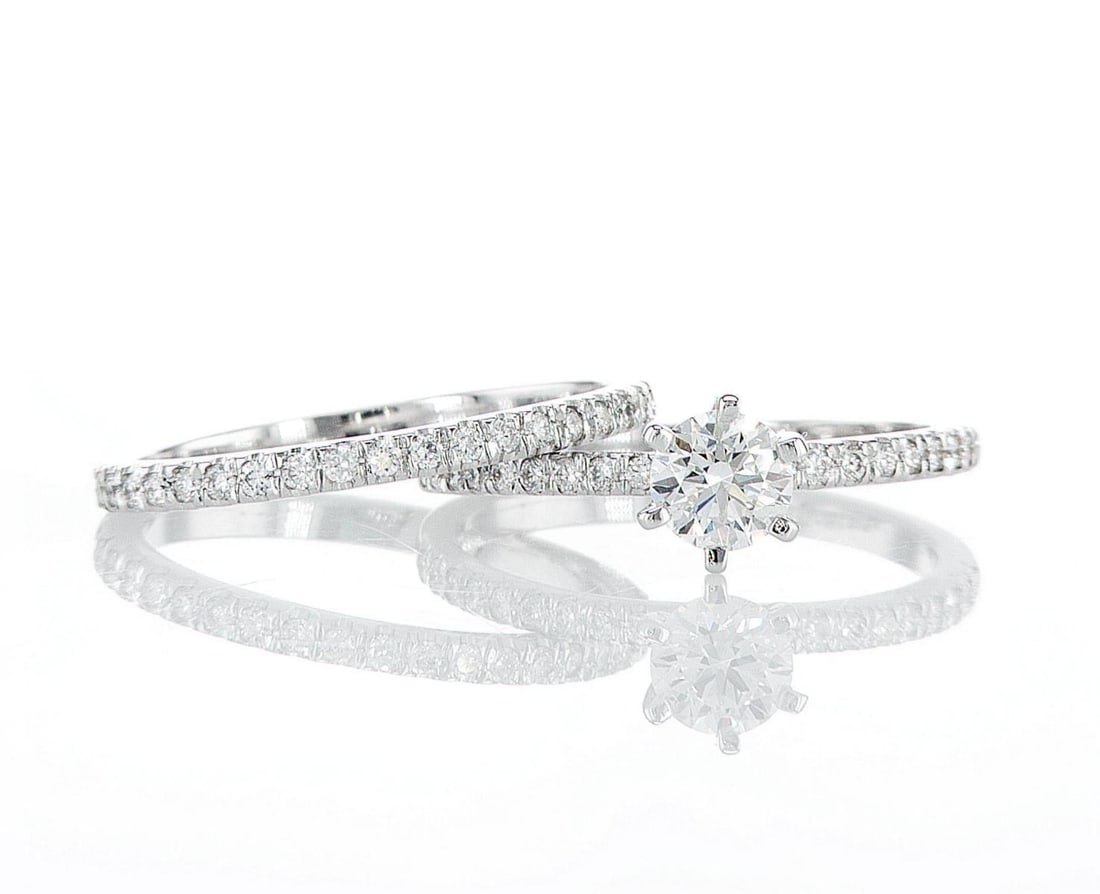 14kt White Gold 1.15ctw Diamond Ring: Jewelry Description Description: Two 14k white gold rings, set with natural diamonds. Jewelry Weight: 3.86 Grs Total Diamonds Weight: 1.15 Cts Precious Metal: 14kt White Gold Certificate Number: DSL- 