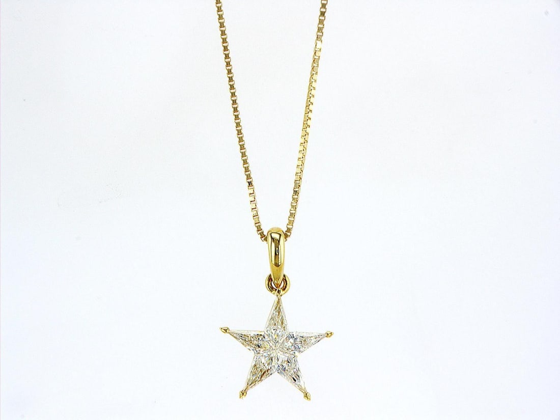 14kt Yellow Gold 0.76ctw Diamond Pendant: One 14k yellow gold pendant with chain (585 stamped), set with five natural diamonds Jewelry Weight: 2.86Grs Total Diamonds Weight: 0.76Cts Main Stones Description: Quantity: 5 Cut and shape: Noble Cu
