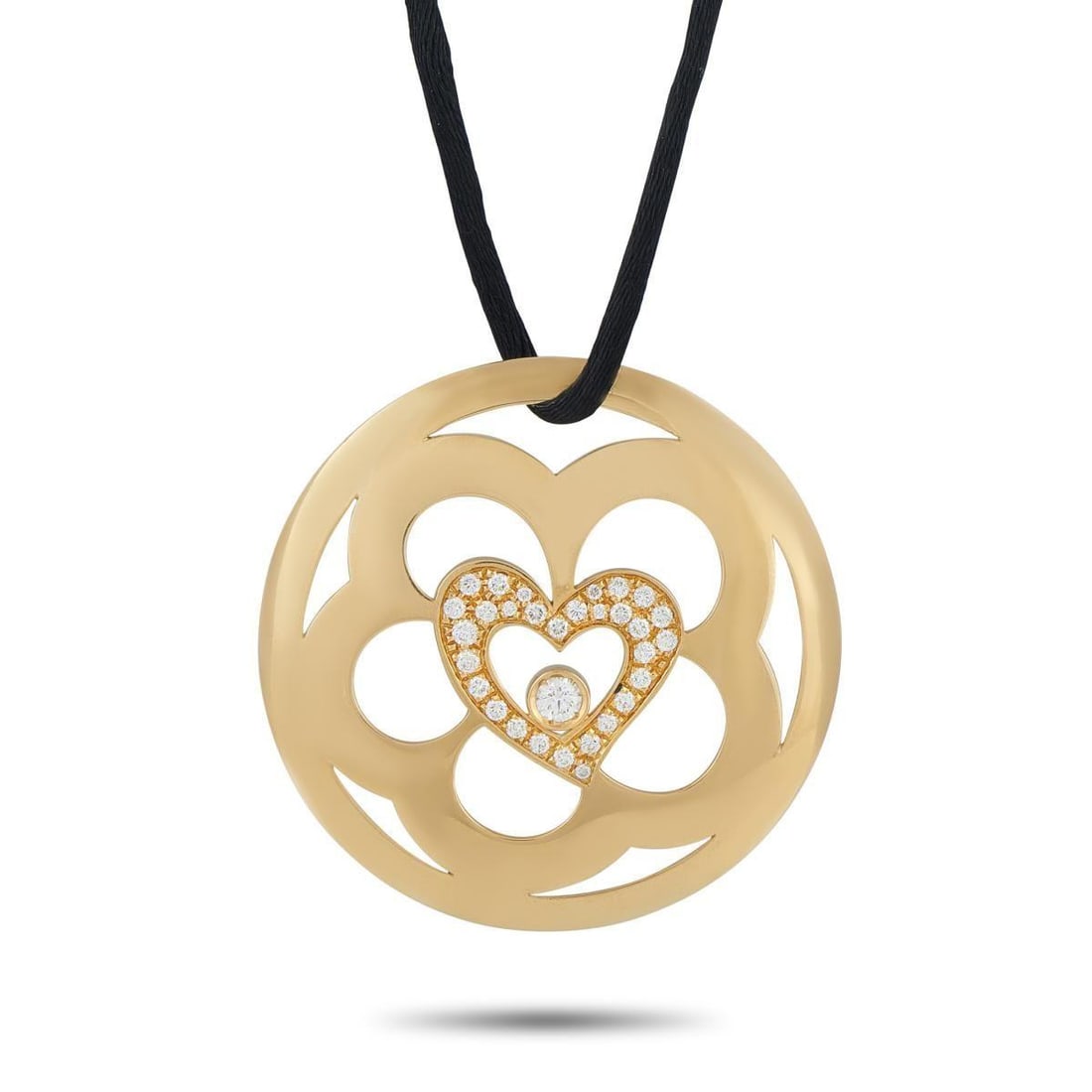ESCADA 18K YELLOW GOLD 0.75CT DIAMOND PENDANT NECKLACE: This striking Escada necklace is meant to make a statement. Negative space gives the 18K Yellow Gold pendant an artistic sensibility. At the center, a heart motif comes to life thanks to sparkling Dia