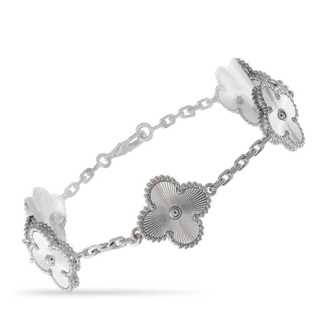VAN CLEEF & ARPELS VINTAGE ALHAMBRA 18K WHITE GOLD BRACELET: This Van Cleef & Arpels Vintage Alhambra bracelet is meant to make a statement. On this piece, the brands iconic clover-shaped motifs come to life in textured 18K White Gold. It measures 7.0 long and 
