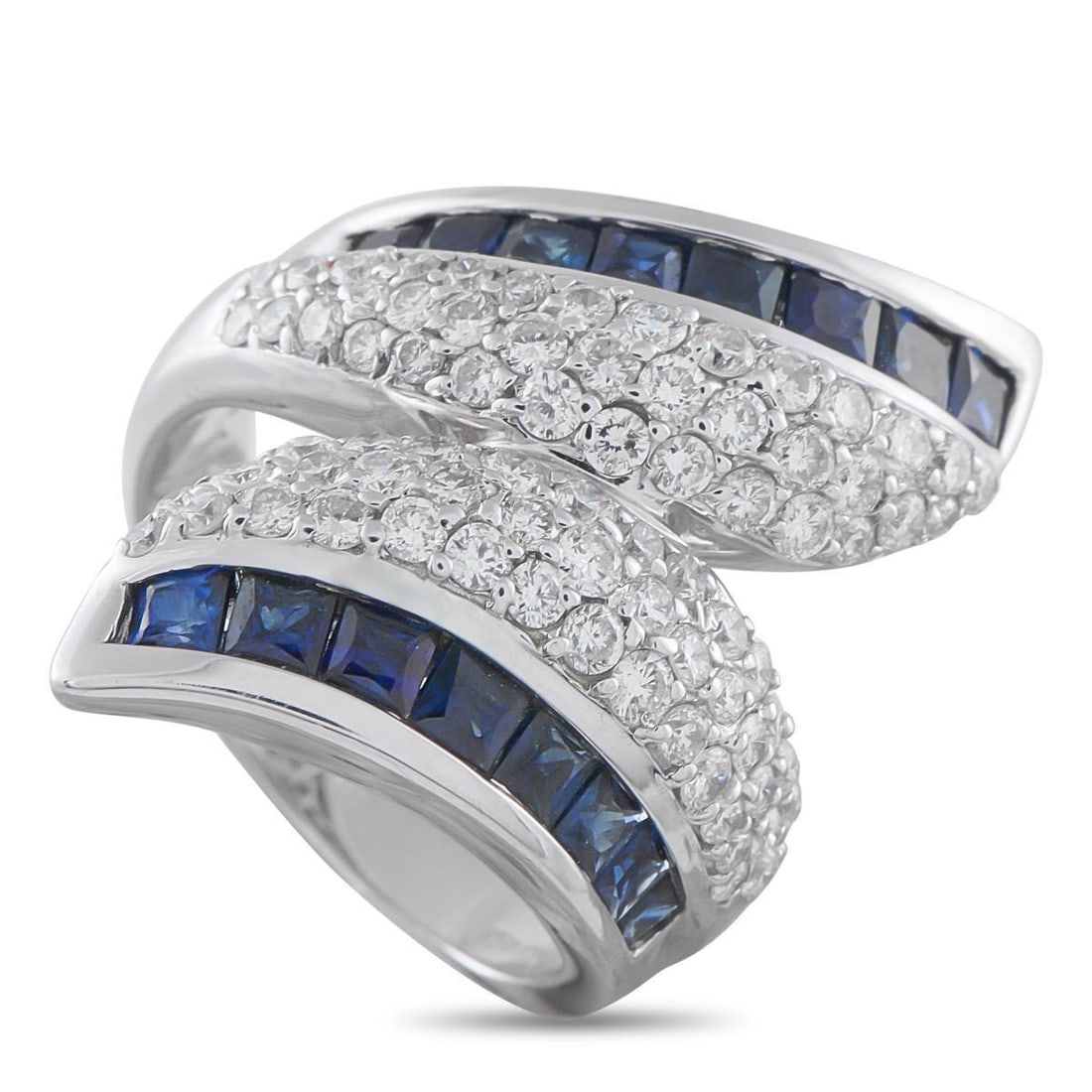 18K WHITE GOLD 1.42CT DIAMOND AND SAPPHIRE RING: A sleek 18K White Gold setting seemingly wraps around the finger on this exquisite luxury ring. Diamonds with a total weight of 1.42 carats add sparkle to the center of the design, while Sapphire acce