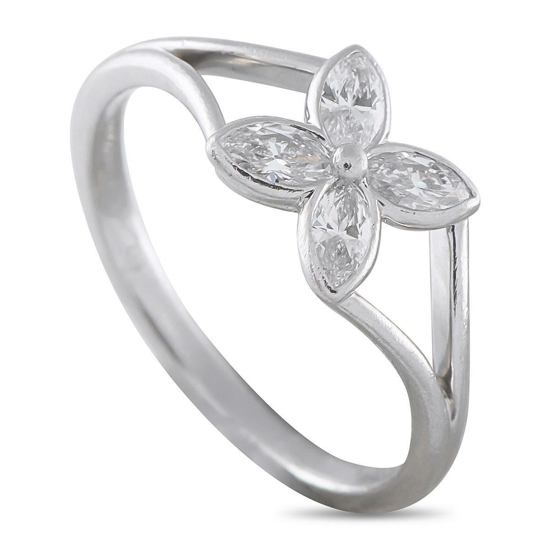 TIFFANY & CO. VICTORIA PLATINUM DIAMOND RING: A sparkling floral motif makes a statement at the center of this Tiffany & Co. Victoria ring. Set in Platinum, the minimalist design beautifully showcases four expertly cut marquise Diamonds. This pie