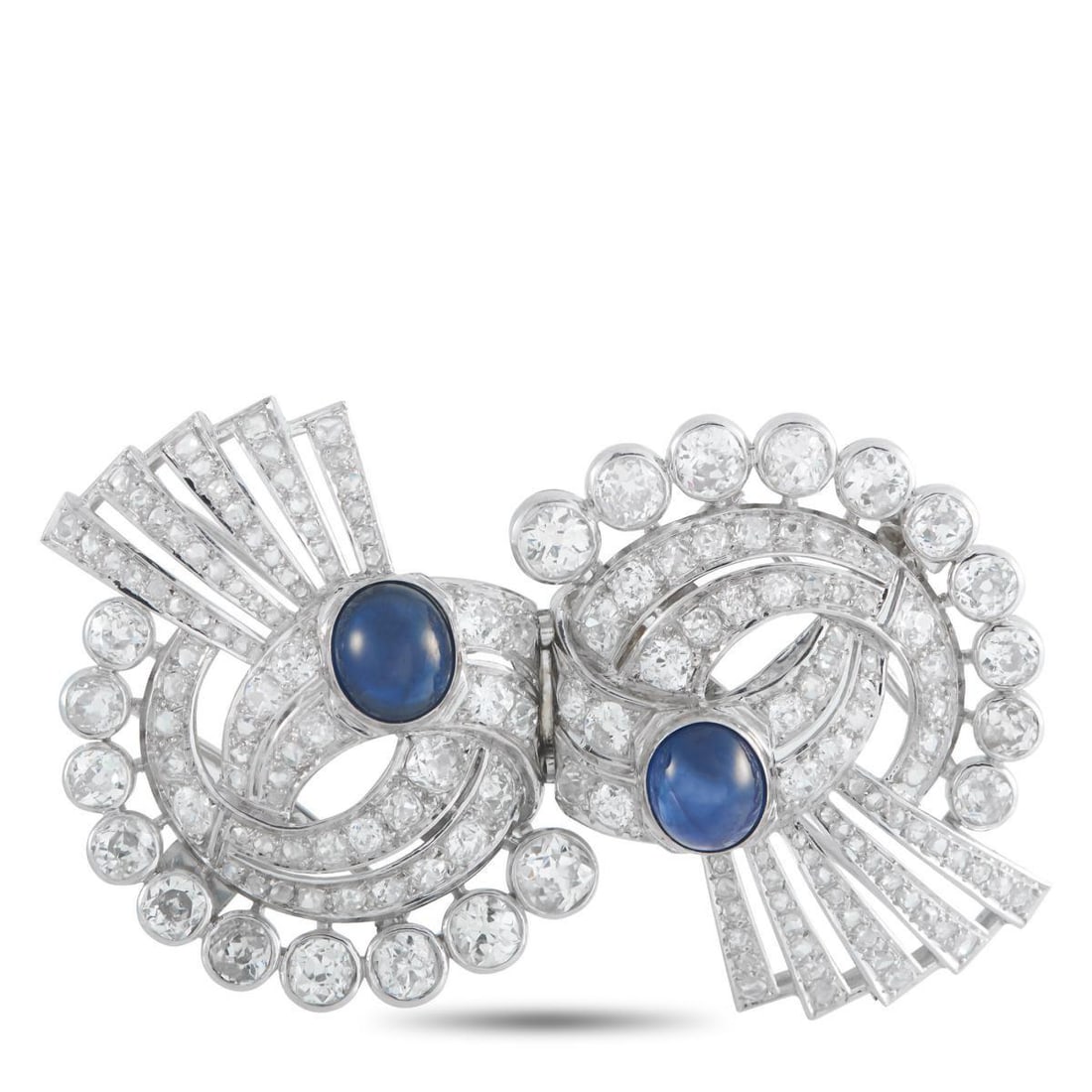 PLATINUM 15.50CT DIAMOND AND SAPPHIRE BROOCH: This exquisitely crafted brooch will instantly add a touch of sparkle to any outfit or occasion. Set in Platinum, Diamonds with a total weight of 15.50 carats allow this piece to come alive every time