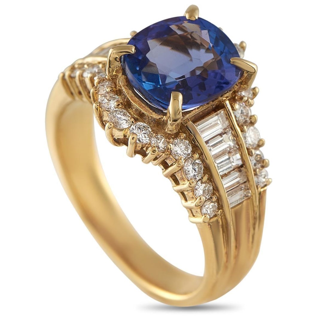 18K YELLOW GOLD 0.85CT DIAMOND AND TANZANITE RING: This opulent ring will continually impress. Sparkling Diamonds with a total weight of 0.85 carats contrast beautifully against the detailed 18K Yellow Gold setting. A 2.24 carat Tanzanite center stone